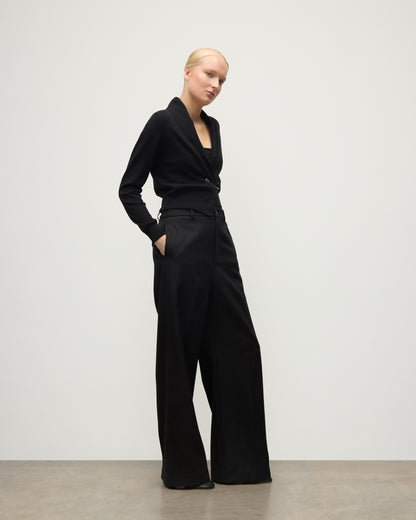 MODEL WEARS JOHNSTONS OF ELGIN WOMENS CRATHIE SHAWL CARDIGAN BLACK 100% CASHMERE WITH BLACK TROUSERS KAP05707SA7210