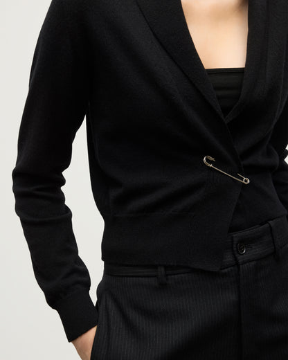 MODEL WEARS JOHNSTONS OF ELGIN WOMENS CRATHIE SHAWL CARDIGAN BLACK 100% CASHMERE WITH KILT PIN AND BLACK TROUSERS KAP05707SA7210