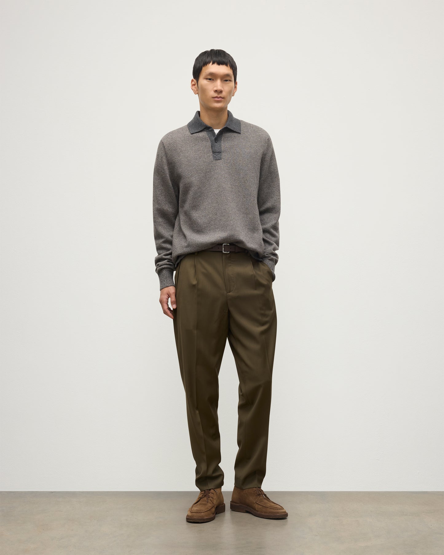 MODEL WEARS JOHNSTONS OF ELGIN MENS TWEEL RUGBY SHIRT 100% CASHMERE OVER A WHITE T-SHIRT WITH OLIVE GREEN TROUSERS KAP05727Q25939