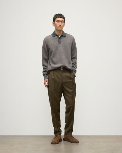 MODEL WEARS JOHNSTONS OF ELGIN MENS TWEEL RUGBY SHIRT 100% CASHMERE OVER A WHITE T-SHIRT WITH OLIVE GREEN TROUSERS KAP05727Q25939