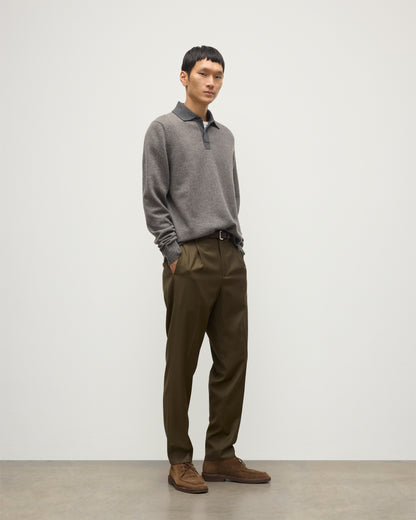 MODEL WEARS JOHNSTONS OF ELGIN MENS TWEEL RUGBY SHIRT 100% CASHMERE OVER A WHITE T-SHIRT WITH OLIVE GREEN TROUSERS KAP05727Q25939