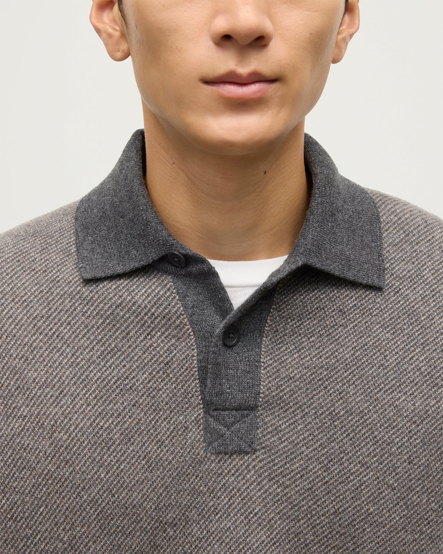 MODEL WEARS JOHNSTONS OF ELGIN MENS TWEEL RUGBY SHIRT 100% CASHMERE OVER A WHITE T-SHIRT  KAP05727Q25939