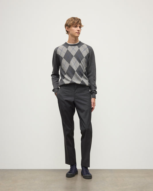 MODEL WEARS JOHNSTONS OF ELGIN MENS ARGYLL CREW SWEATER GREY & BROWN 100% CASHMERE WITH GREY TROUSERS KAP05747JU1601