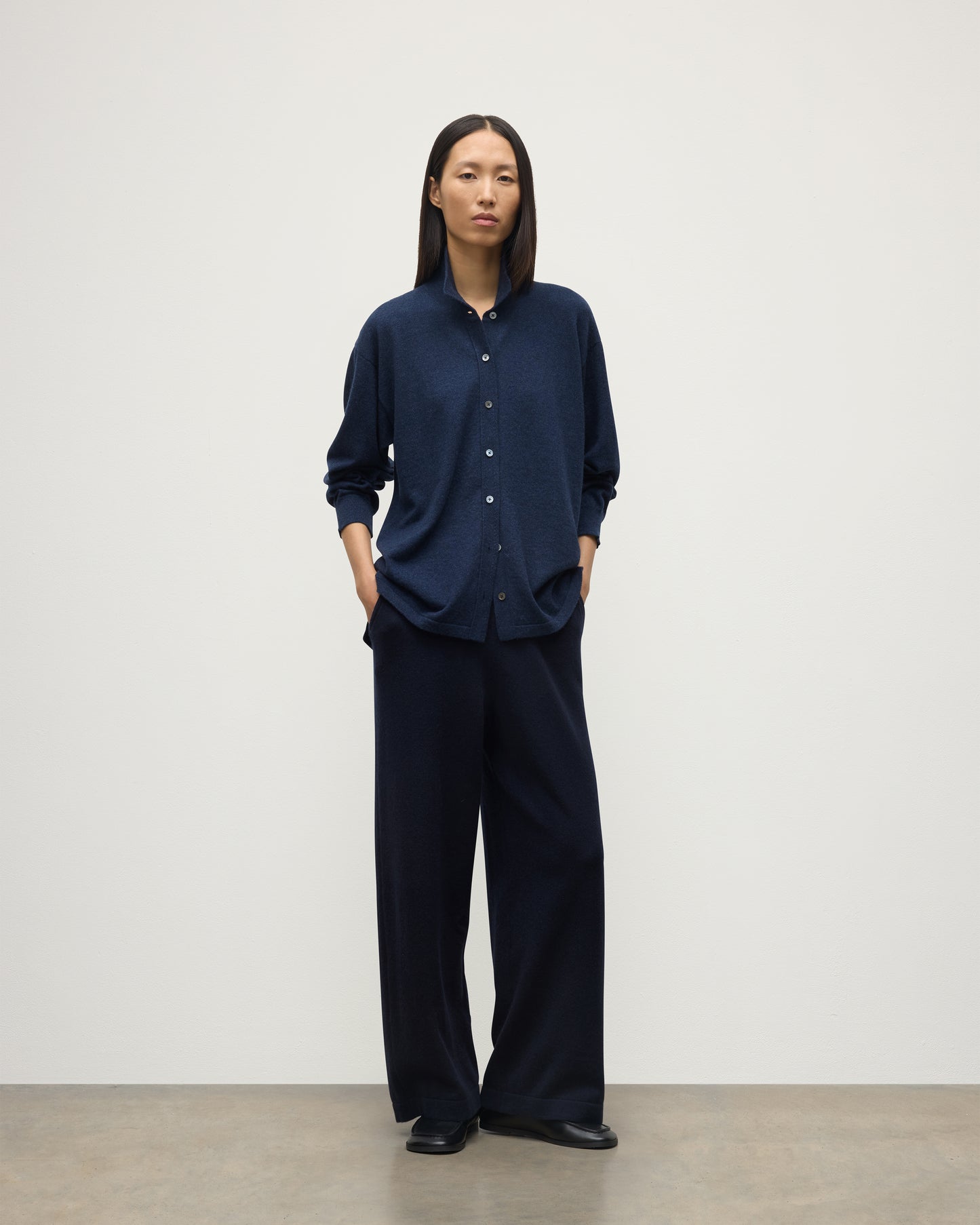 MODEL WEARS JOHNSTONS OF ELGIN WOMENS MUNRO SHIRT NAVY 100% CASHMERE WITH CASHMERE CULOTTES KAP05765HD7350