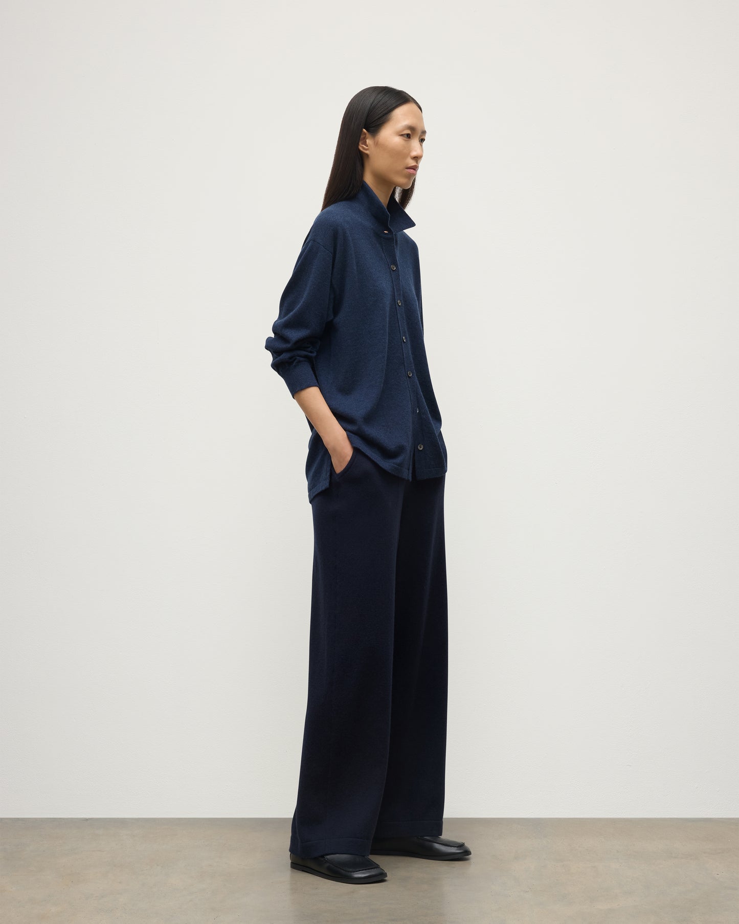 MODEL WEARS JOHNSTONS OF ELGIN WOMENS MUNRO SHIRT NAVY 100% CASHMERE WITH CASHMERE CULOTTES KAP05765HD7350