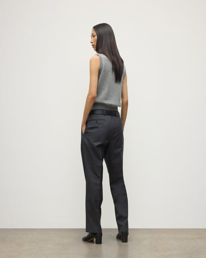 MODEL WEARS JOHNSTONS OF ELGIN WOMENS ARGYLL LE JABOTS SLEEVELESS CREW GREY 100% CASHMERE WITH BELTED GREY TROUSERS AND BLACK BOOTS KAP05766JU1611