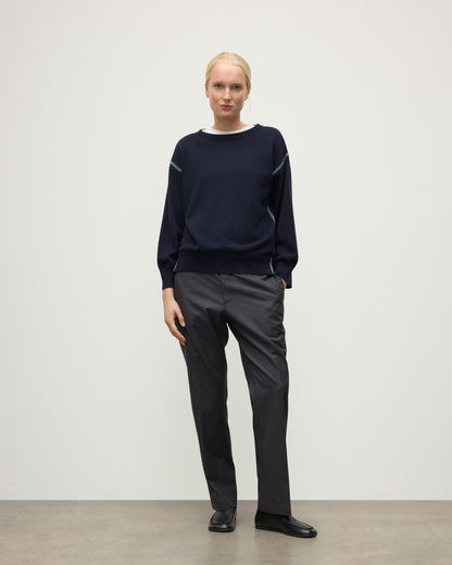 MODEL WEARING JOHNSTONS OF ELGIN WOMENS TILDA CREW SWEATER NAVY WITH GREY TROUSERS KAP05768Q25971