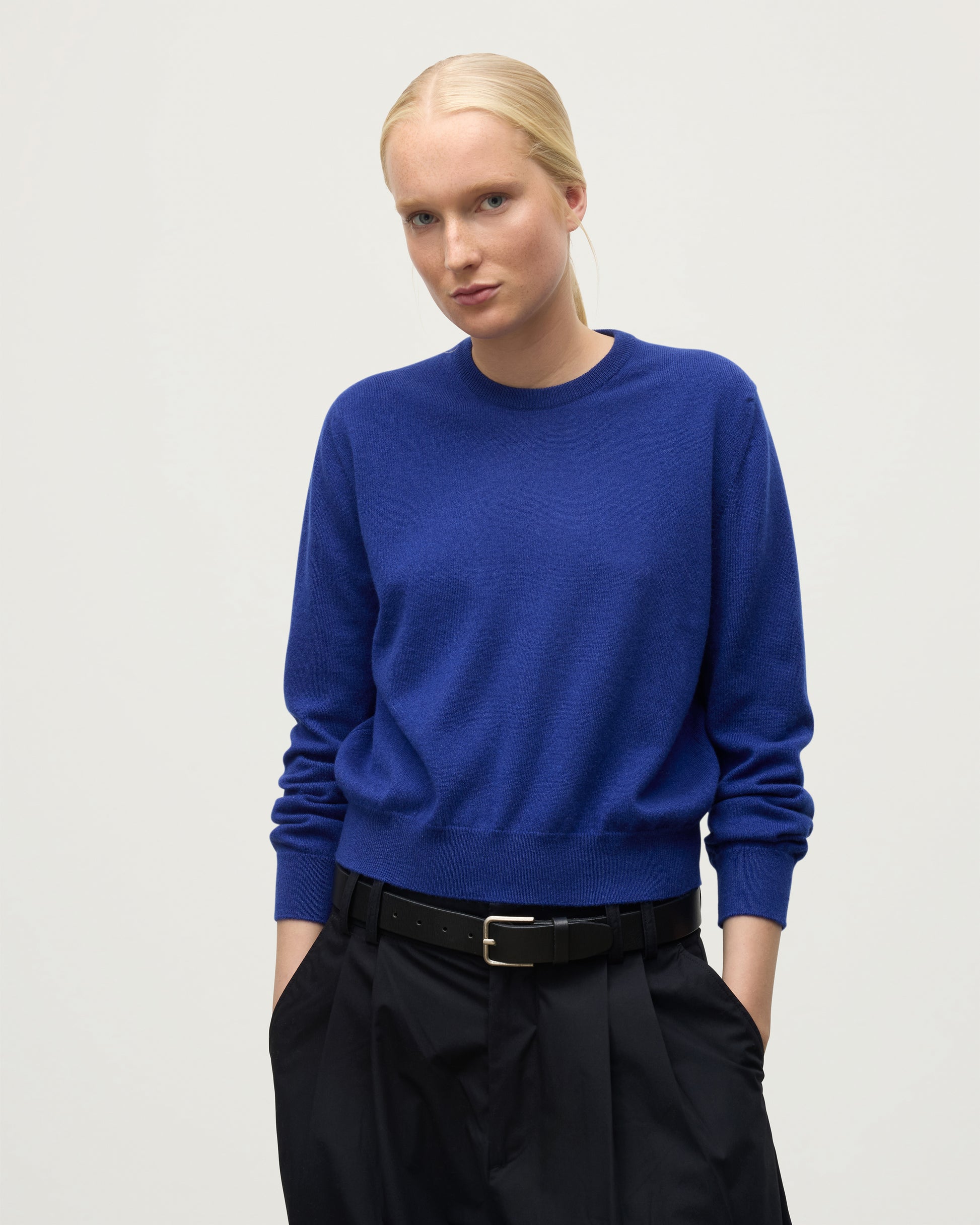 MODEL WEARS JOHNSTONS OF ELGIN WOMENS LUNAN CLASSIC CREW SWEATER BLUE KAP05784SD5326