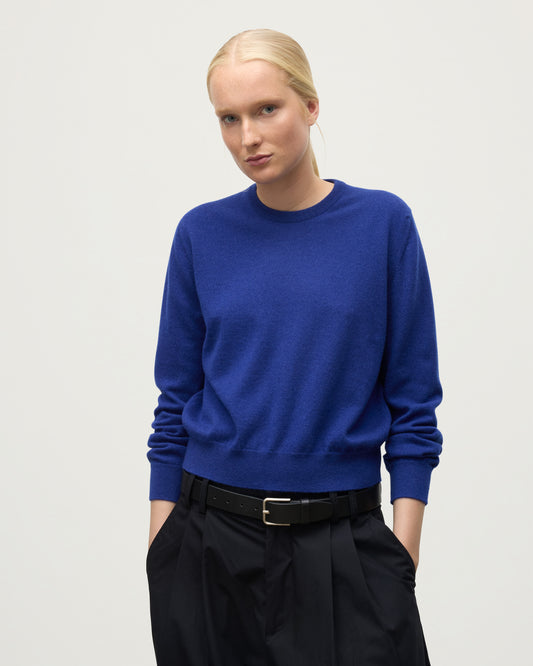 MODEL WEARS JOHNSTONS OF ELGIN WOMENS LUNAN CLASSIC CREW SWEATER BLUE KAP05784SD5326