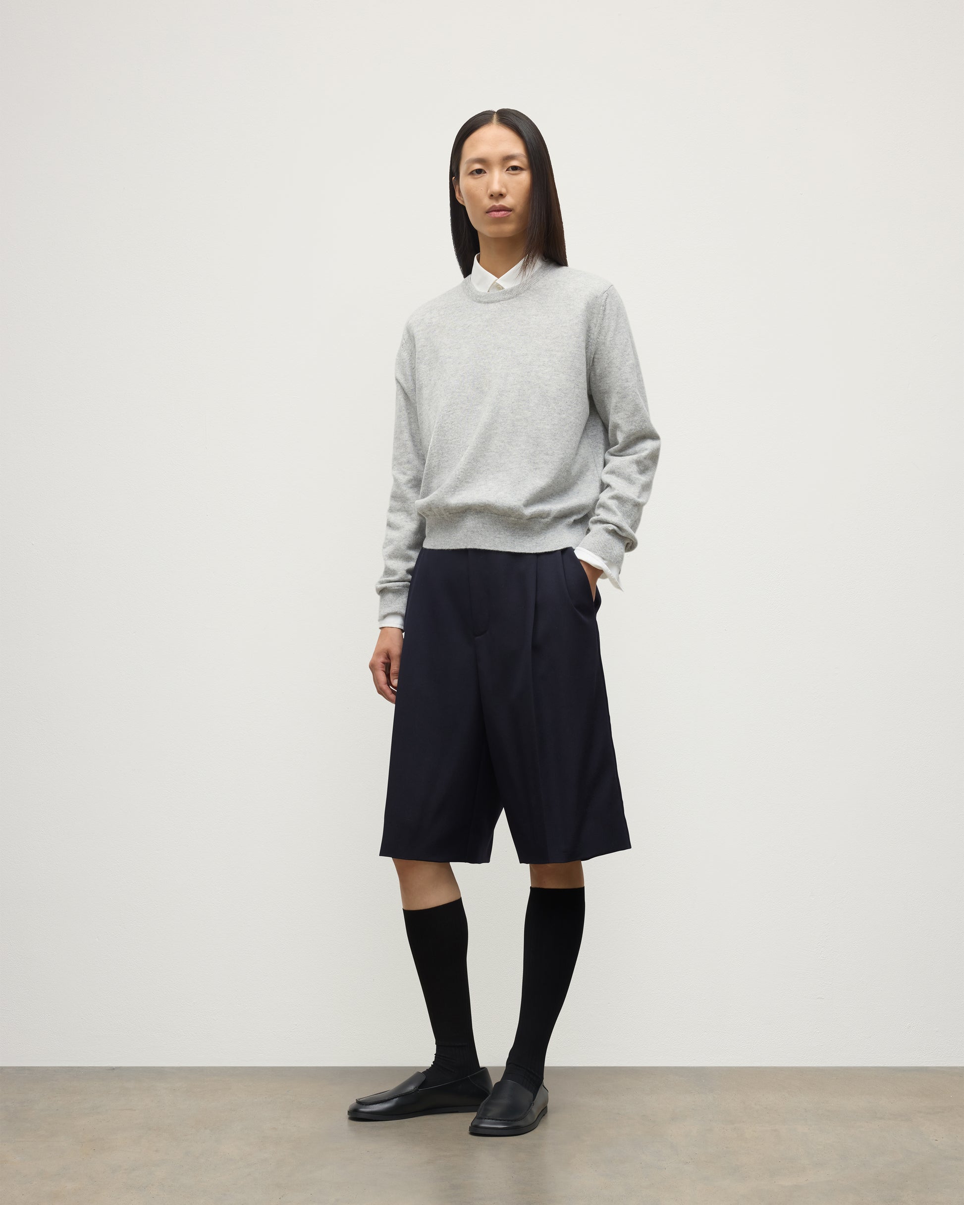 MODEL WEARING JOHNSTONS OF ELGIN WOMENS LUNAN CLASSIC CREW SWEATER GREY WITH BLACK LONG SHIRTS KAP05784HA0399