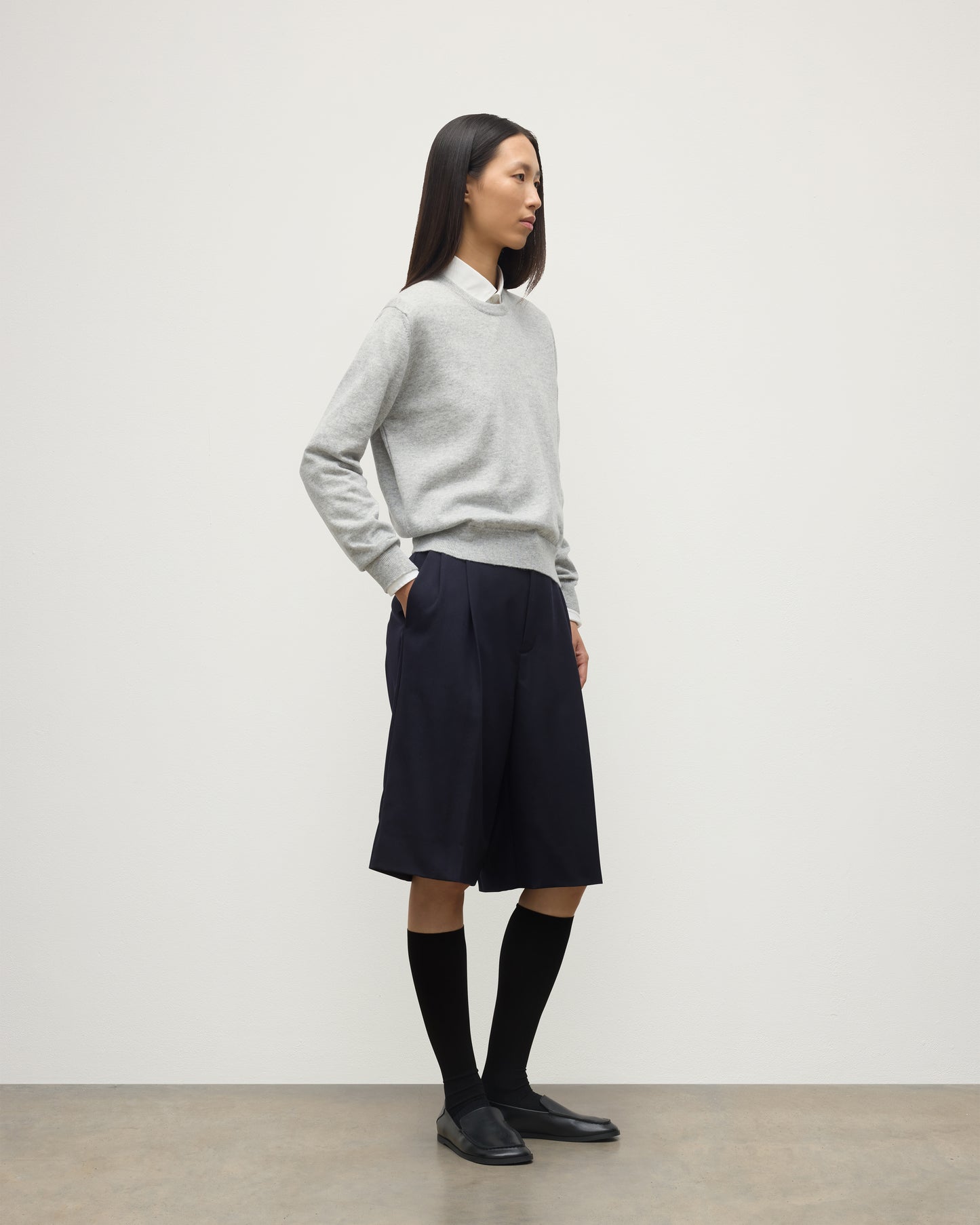 MODEL WEARING JOHNSTONS OF ELGIN WOMENS LUNAN CLASSIC CREW SWEATER GREY WITH BLACK LONG SHIRTS KAP05784HA0399