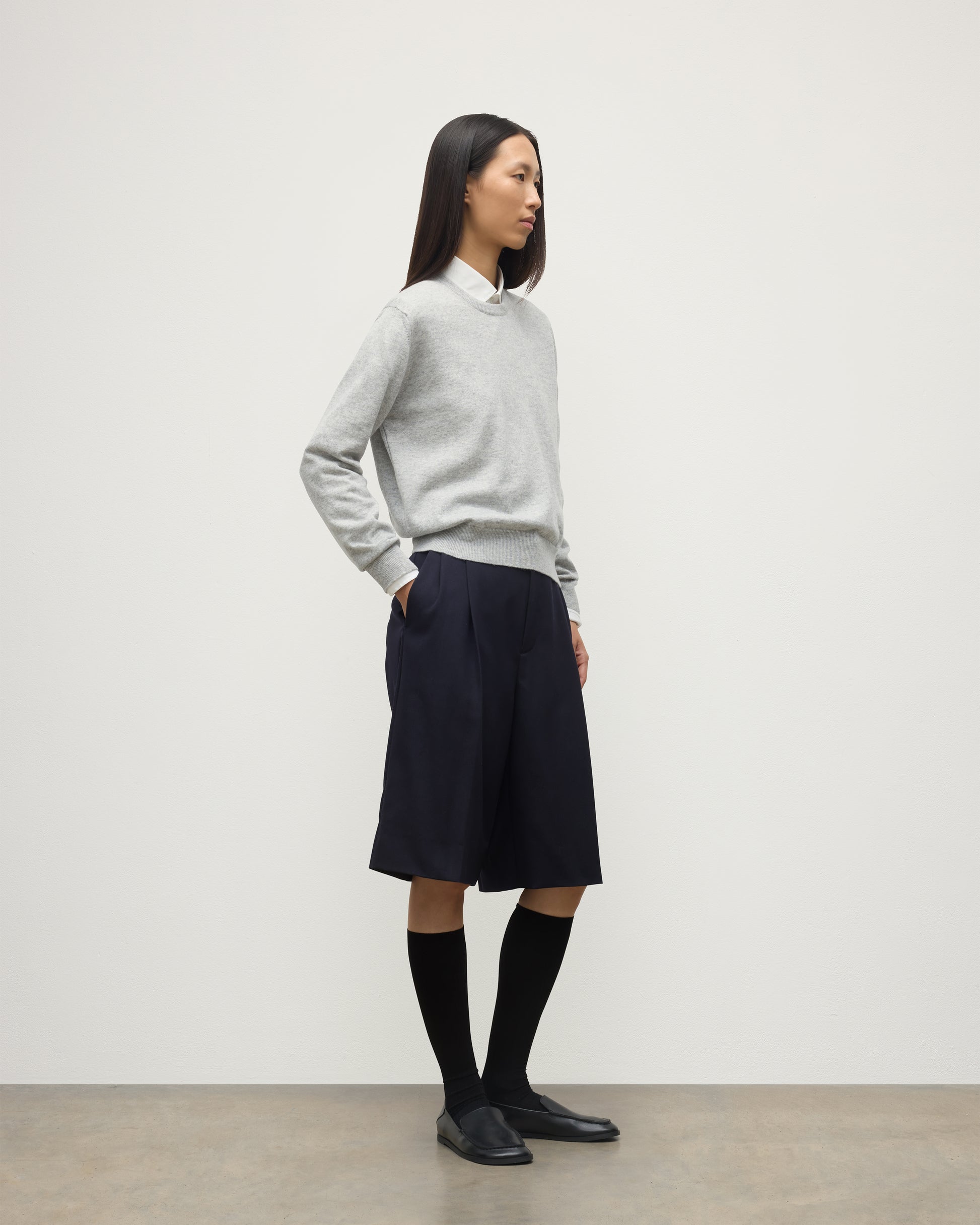 MODEL WEARING JOHNSTONS OF ELGIN WOMENS LUNAN CLASSIC CREW SWEATER GREY WITH BLACK LONG SHIRTS KAP05784HA0399