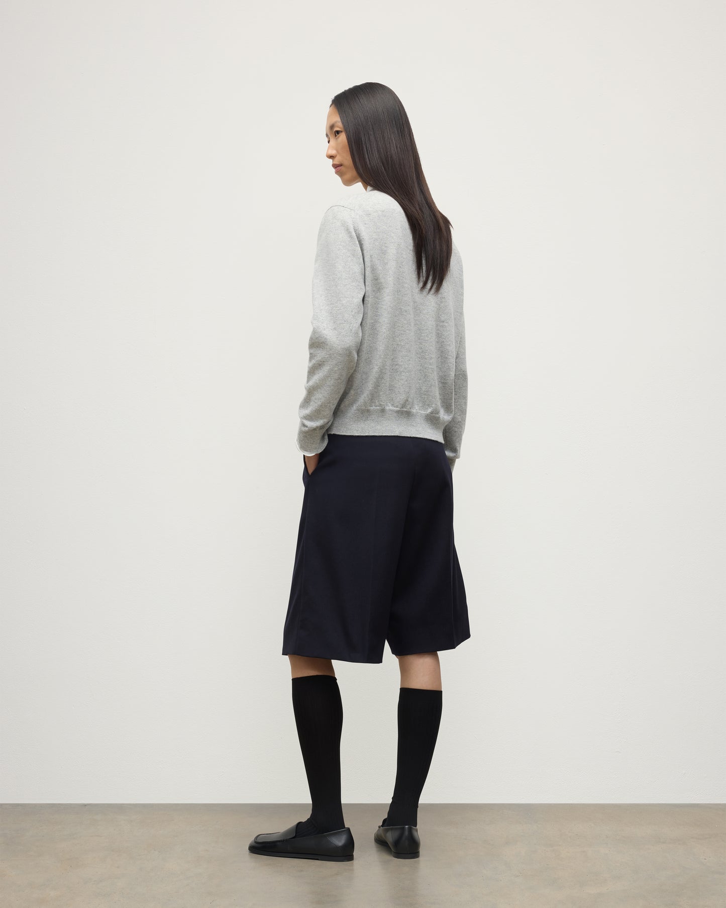 MODEL WEARING JOHNSTONS OF ELGIN WOMENS LUNAN CLASSIC CREW SWEATER GREY WITH BLACK LONG SHIRTS KAP05784HA0399