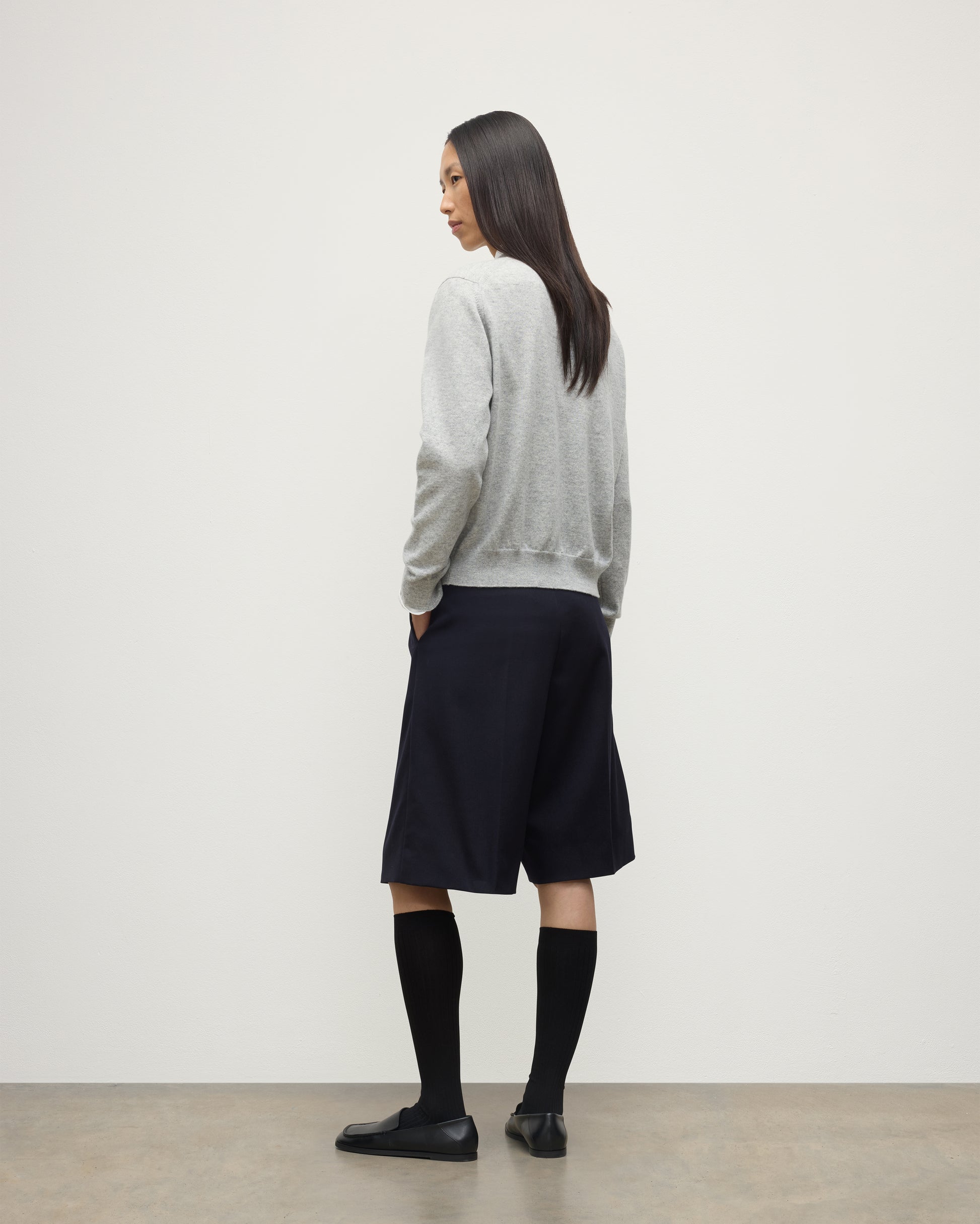 MODEL WEARING JOHNSTONS OF ELGIN WOMENS LUNAN CLASSIC CREW SWEATER GREY WITH BLACK LONG SHIRTS KAP05784HA0399