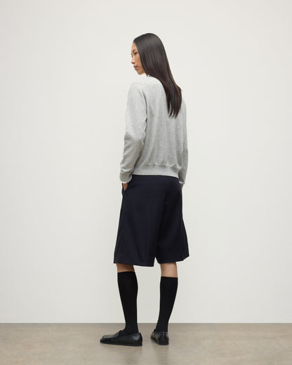 MODEL WEARING JOHNSTONS OF ELGIN WOMENS LUNAN CLASSIC CREW SWEATER GREY WITH BLACK LONG SHIRTS KAP05784HA0399