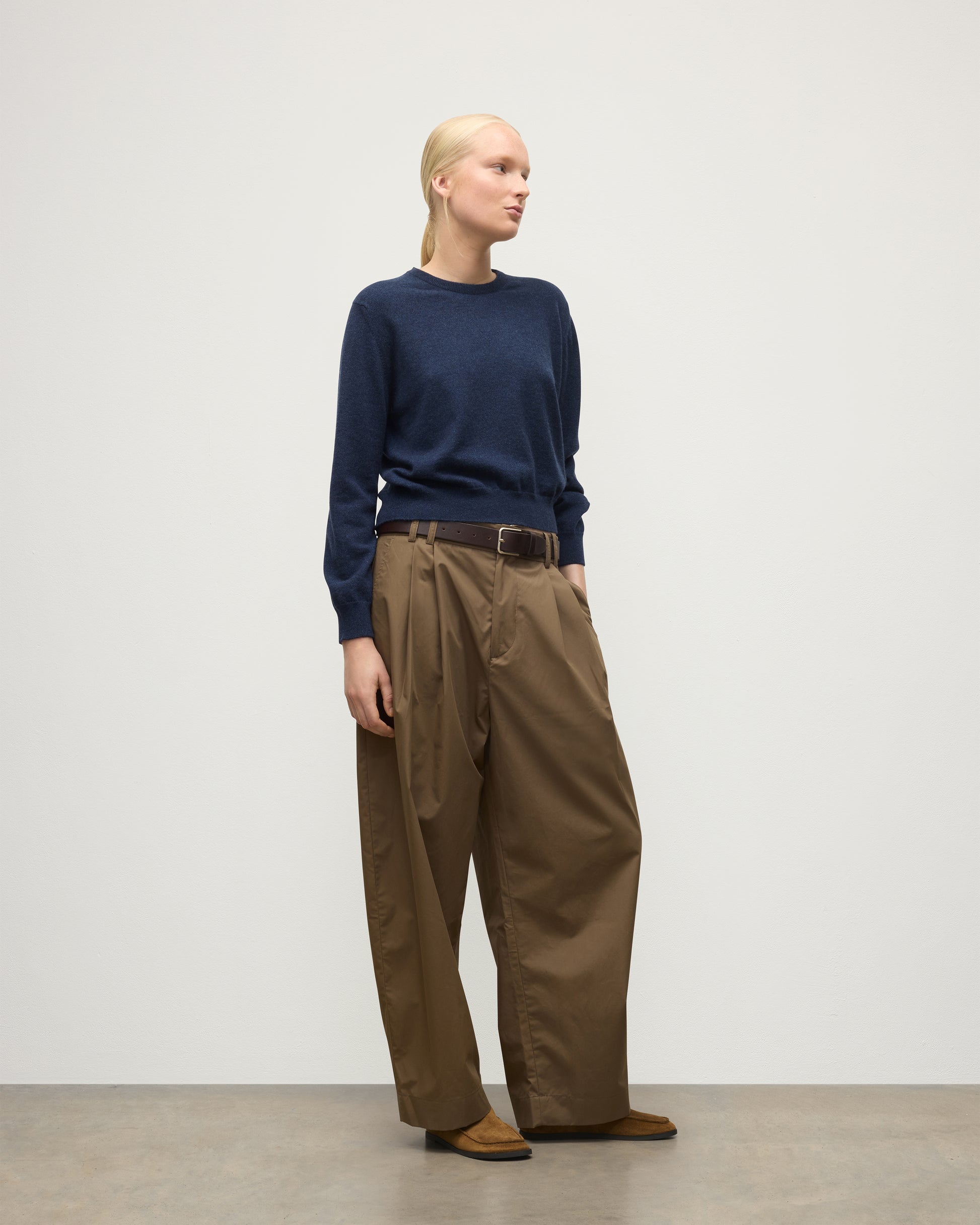 MODEL WEARS JOHNSTONS OF ELGIN WOMENS LUNAN CLASSIC CREW SWEATER NAVY WITH BROWN WIDE LEG TROUSERS KAP05784HD7350
