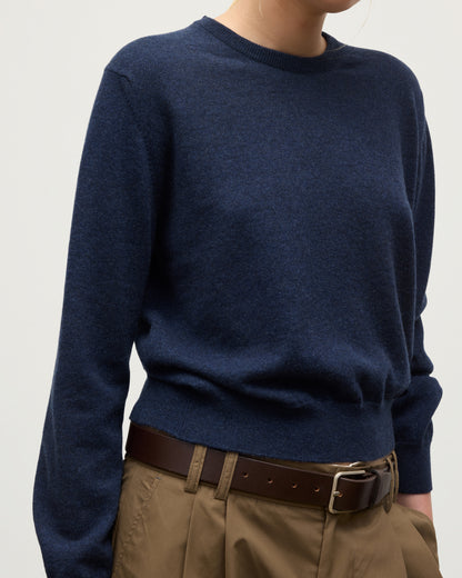 MODEL WEARS JOHNSTONS OF ELGIN WOMENS LUNAN CLASSIC CREW SWEATER NAVY WITH BELTED  BROWN TROUSERS KAP05784HD7350