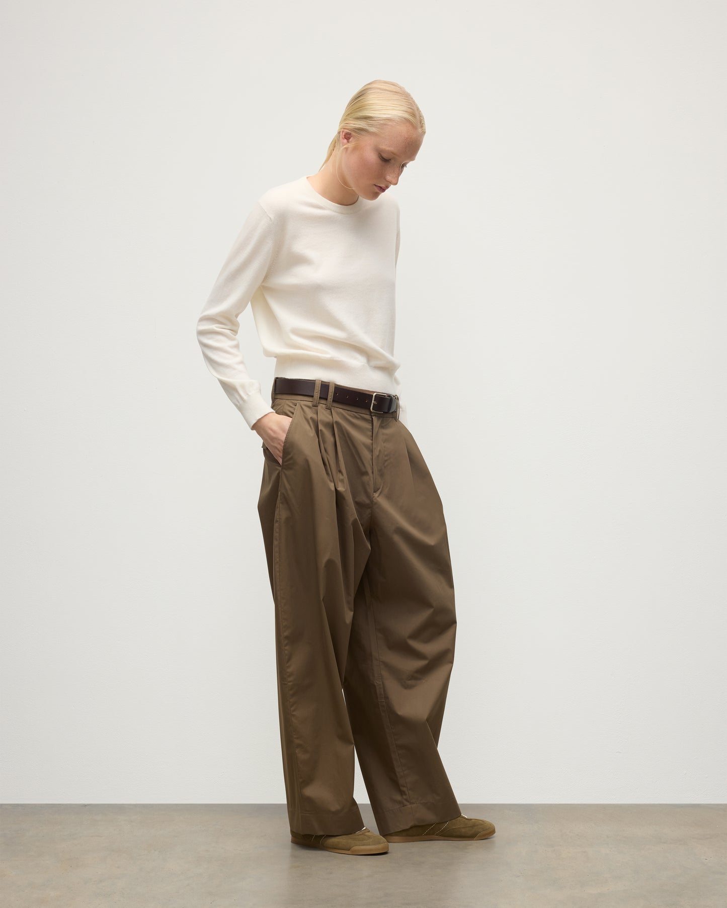 MODEL WEARS JOHNSTONS OF ELGIN WOMENS LUNAN CLASSIC CREW SWEATER WHITE WITH BROWN TROUSERS KAP05784SA0606