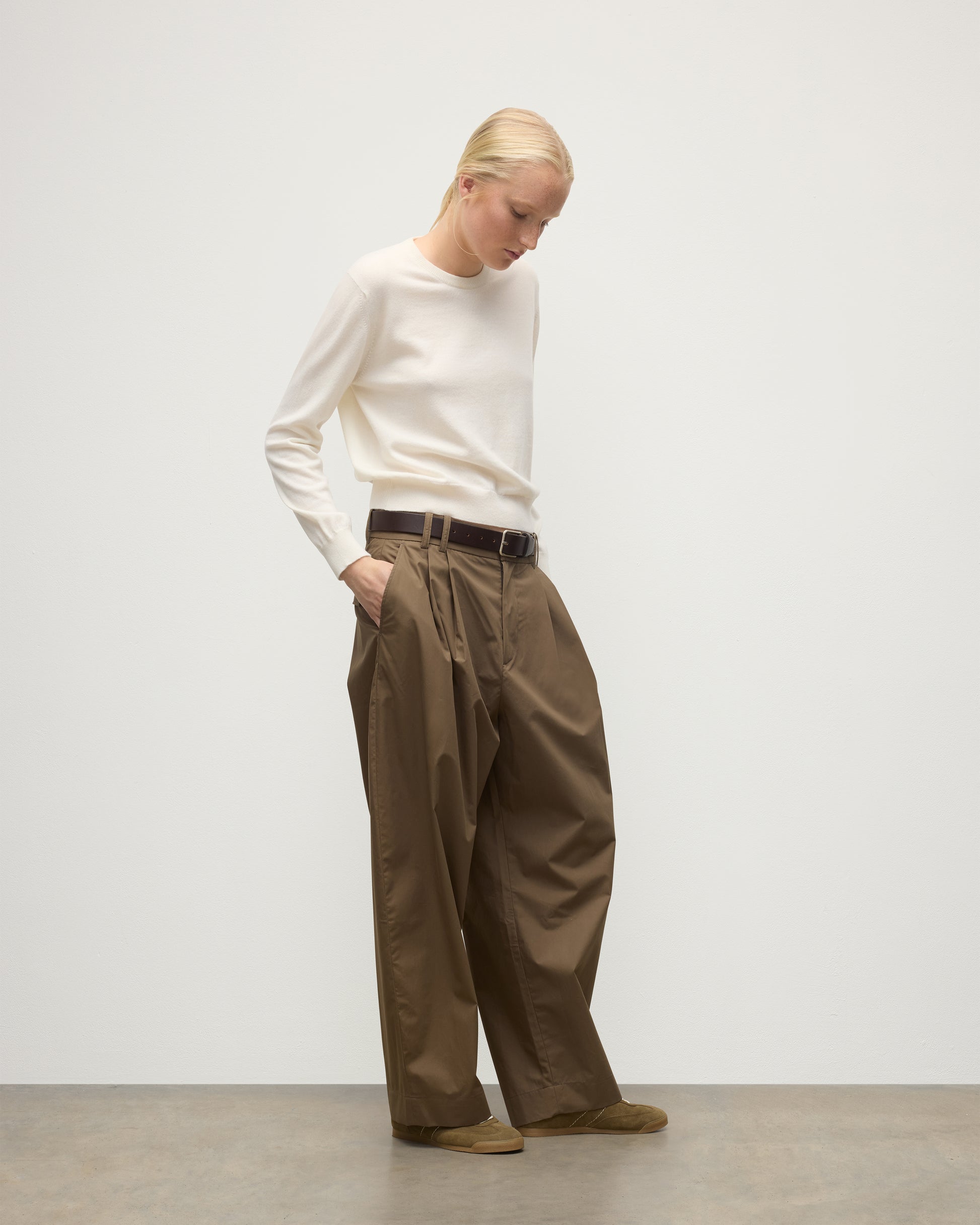 MODEL WEARS JOHNSTONS OF ELGIN WOMENS LUNAN CLASSIC CREW SWEATER WHITE WITH BROWN TROUSERS KAP05784SA0606