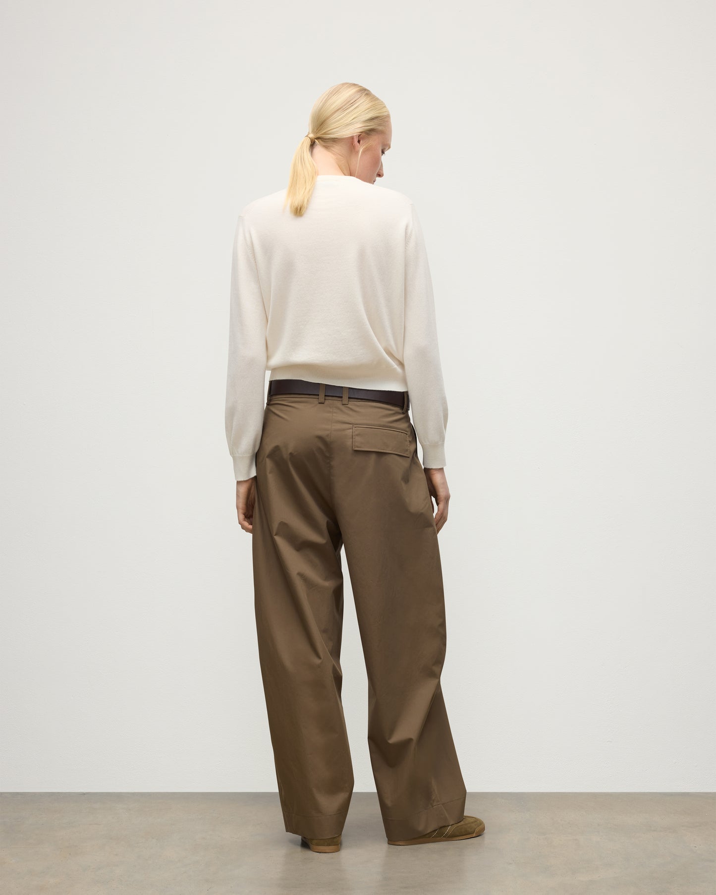 MODEL WEARS JOHNSTONS OF ELGIN WOMENS LUNAN CLASSIC CREW SWEATER WHITE WITH BROWN TROUSERS KAP05784SA0606