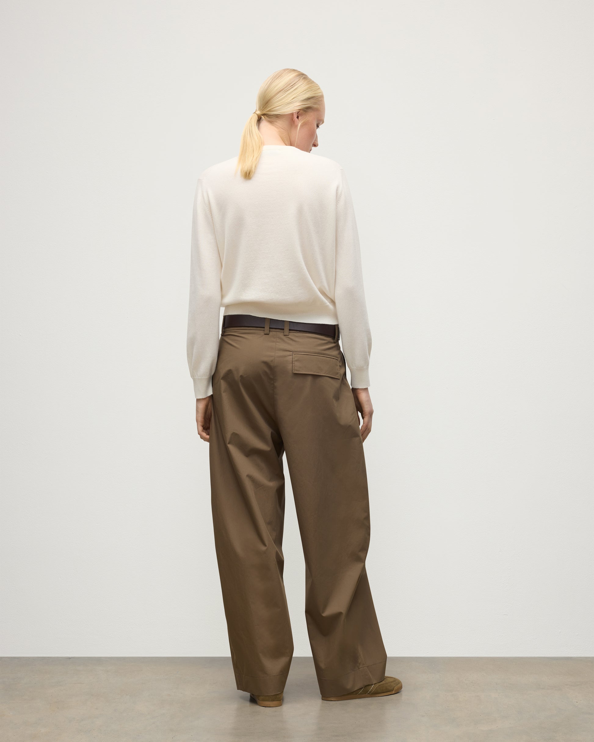 MODEL WEARS JOHNSTONS OF ELGIN WOMENS LUNAN CLASSIC CREW SWEATER WHITE WITH BROWN TROUSERS KAP05784SA0606