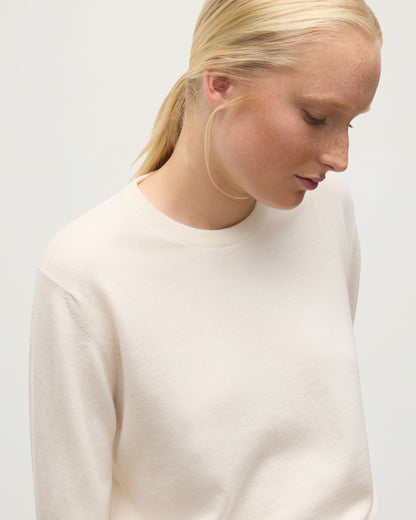 MODEL WEARS JOHNSTONS OF ELGIN WOMENS LUNAN CLASSIC CREW SWEATER WHITE KAP05784SA0606