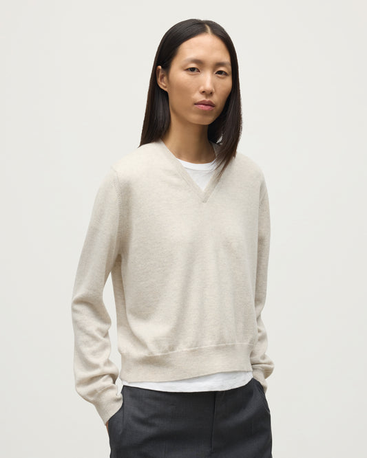 MODEL WEARING JOHNSTONS OF ELGIN WOMENS LUNAN CLASSIC VEE SWEATER NATURAL 100% CASHMERE KAP05807HA0402