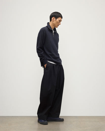 MODEL WEARS JOHNSTONS OF ELGIN MENS TWEEL HALF ZIP SWEATER NAVY & DARK GREY 100% CASHMERE OVER A WHITE T-SHIRT WITH NAVY TROUSERS KAP05832Q25934