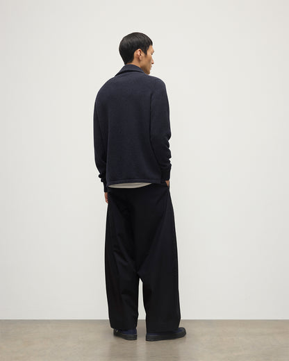 MODEL WEARS JOHNSTONS OF ELGIN MENS TWEEL HALF ZIP SWEATER NAVY & DARK GREY 100% CASHMERE OVER A WHITE T-SHIRT WITH NAVY TROUSERS KAP05832Q25934