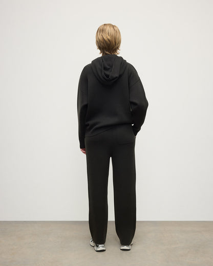 Model wears Johnstons of Elgin AW25 Women's Knitwear Iron & Black Double-Face Black Cashmere Joggers Back KBA01036Q25336