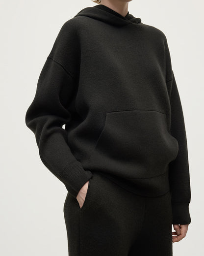model wears Johnstons of Elgin AW25 Women's Knitwear Iron & Black Double-Face Black Cashmere Hoodie close up  KBA01034Q25336