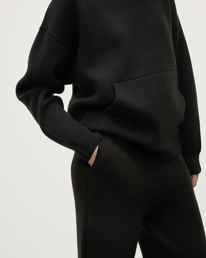 Model wears Johnstons of Elgin AW25 Women's Knitwear Iron & Black Double-Face Black Cashmere Joggers details KBA01036Q25336