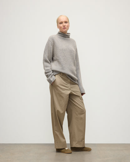 FEMALE MODEL WEARING JOHNSTONS OF ELGIN KESTER FUNNEL NECK SWEATER BLUE 100% CASHMERE UBB01067HD4499