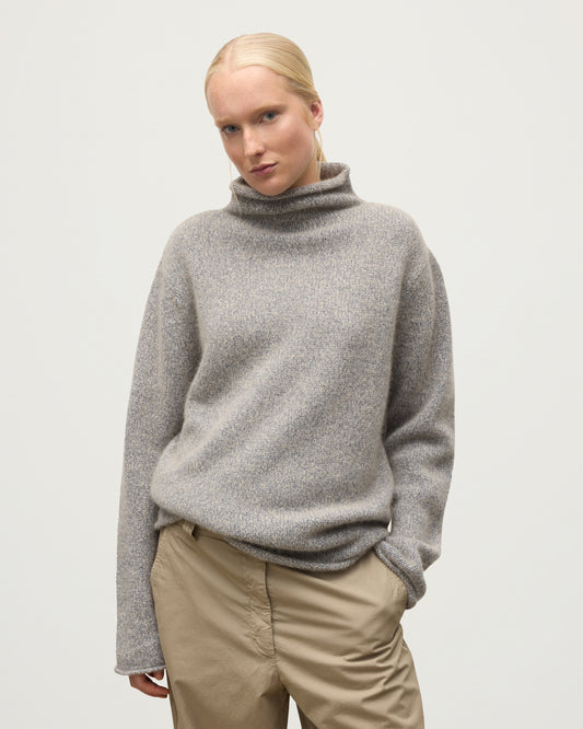 FEMALE MODEL WEARING JOHNSTONS OF ELGIN KESTER FUNNEL NECK SWEATER BLUE 100% CASHMERE UBB01067HD4499