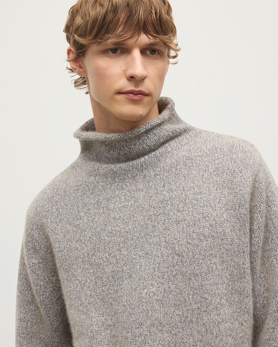 MALE MODEL WEARING JOHNSTONS OF ELGIN KESTER FUNNEL NECK SWEATER BLUE 100% CASHMERE KBB01067HB4453