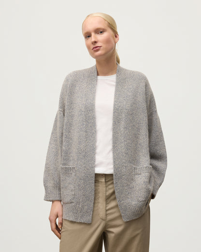 MODEL WEARS JOHNSTONS OF ELGIN WOMENS BAY SLOUCH CARDIGAN BLUE 78% CASHMERE 22% COTTON OVER A WHITE T-SHIRT KBB01069HD4499