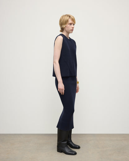 Model wears Johnstons of Elgin Women's Cashmere Midi Skirt in Navy KBC01032SD7666