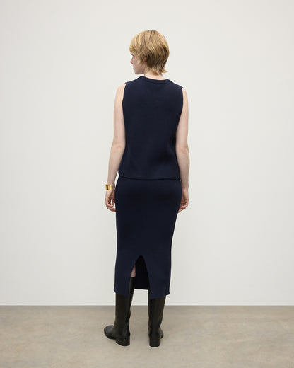 Model wears Johnstons of Elgin Women's Cashmere Midi Skirt in Navy KBC01032SD7666