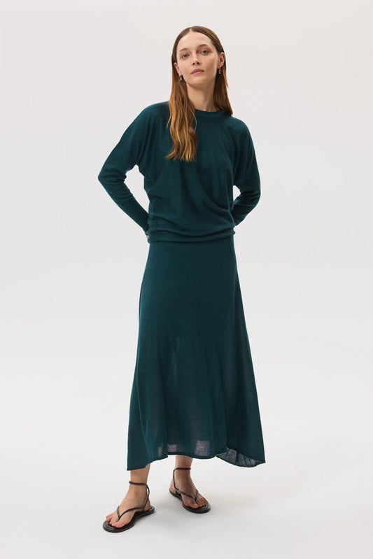 Johnstons of Elgin SS25 Women's Knitwear Emerald Cashmere Silk A-Line Skirt, with matching cashmere batwing sweater against a white background KBI00976SC7242