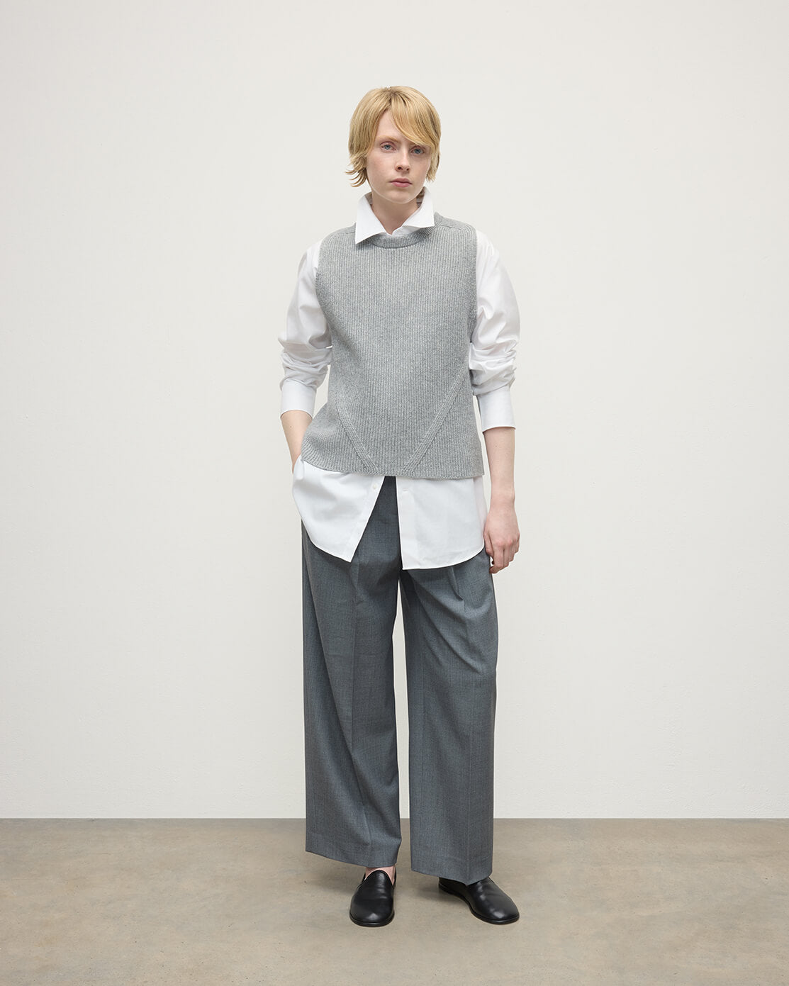 Model wearing Johnstons of Elgin AW25 Women's Knitwear Light Grey Sleeveless Grey Cashmere Tank Top KBI01037HA0308