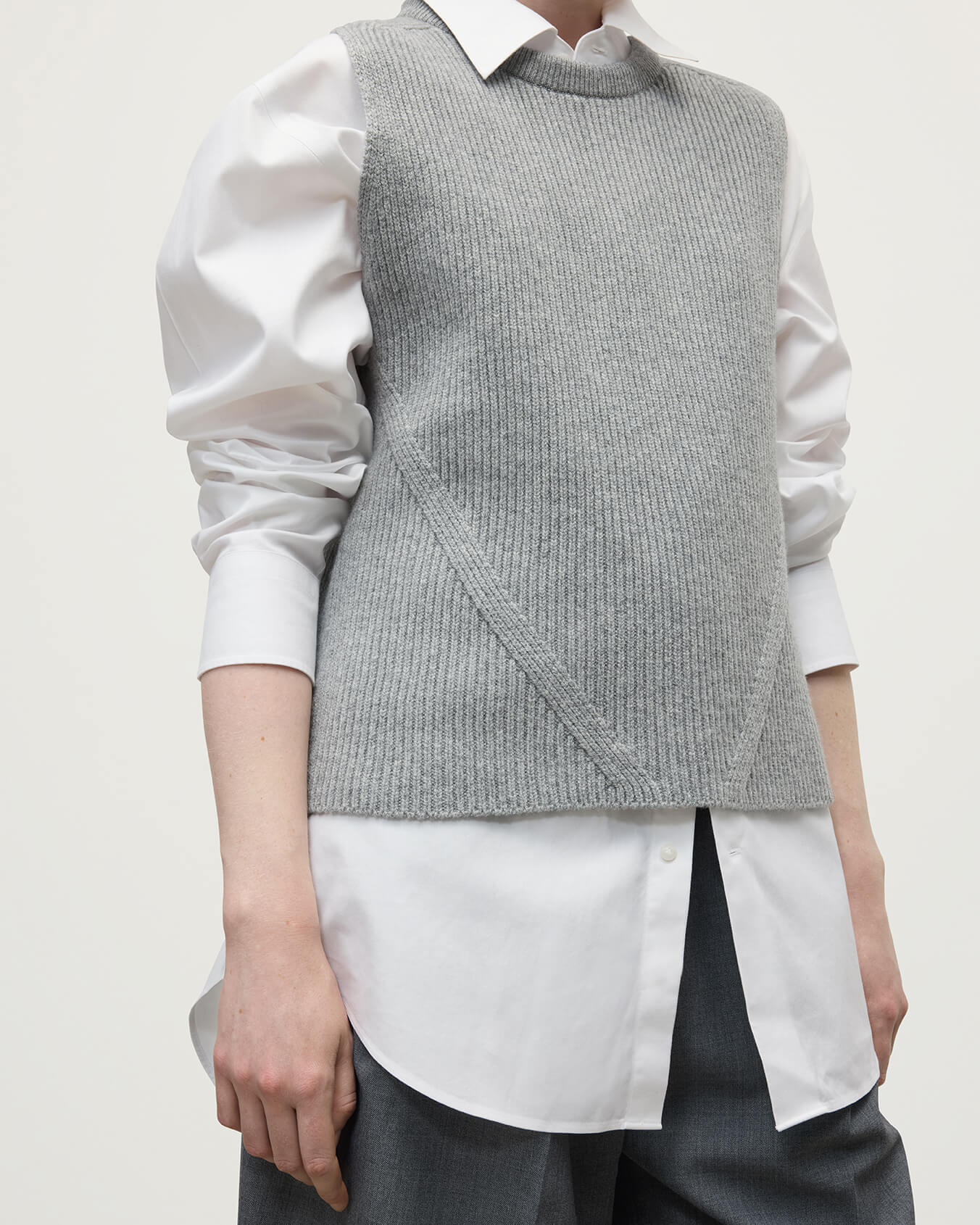 Model wearing Johnstons of Elgin AW25 Women's Knitwear Light Grey Sleeveless Grey Cashmere Tank Top Close Up KBI01037HA0308