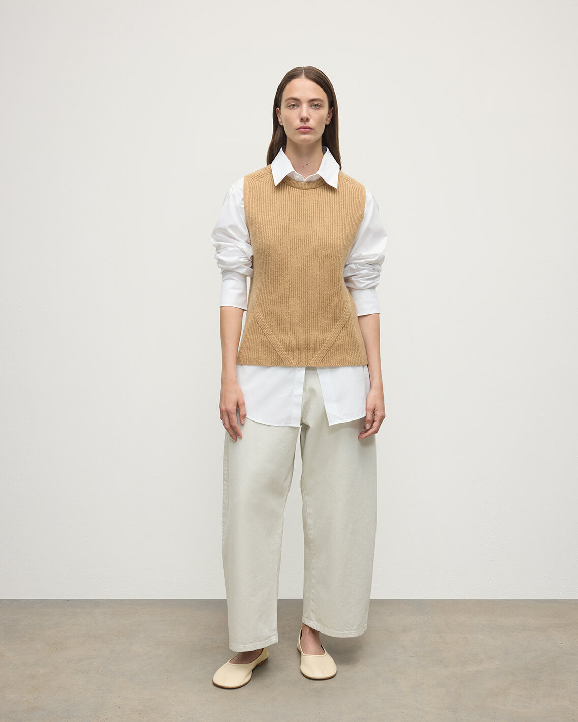 model wearing Johnstons of Elgin AW25 Women's Knitwear Camel Sleeveless Camel Cashmere Tank Top KBI01037HB4404