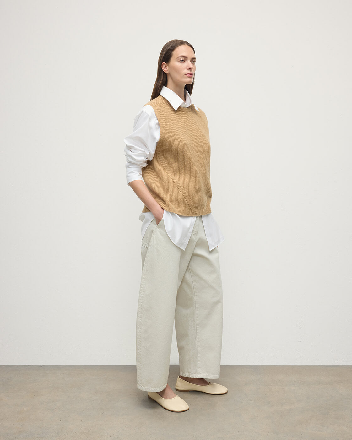 model wearing Johnstons of Elgin AW25 Women's Knitwear Camel Sleeveless Camel Cashmere Tank Top Side KBI01037HB4404