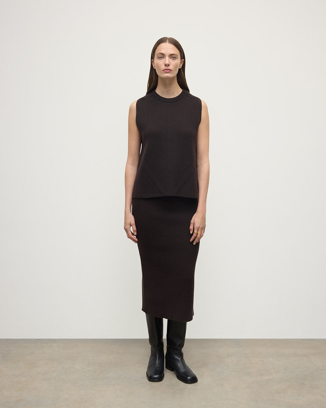 Model wears Johnstons of Elgin AW25 Women's Knitwear Molasses Sleeveless Brown Cashmere Tank Top KBI01037SB7290