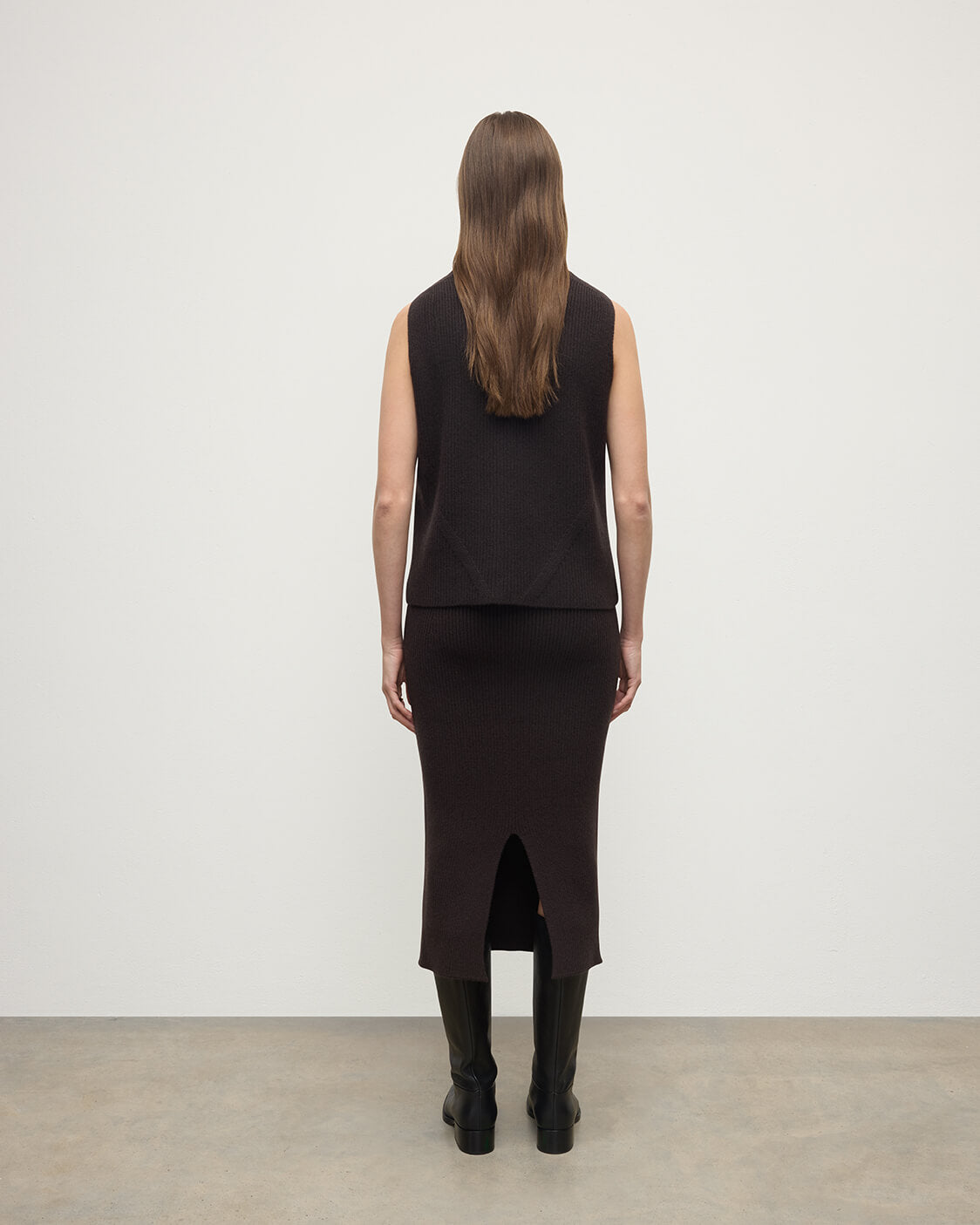 Model wears Johnstons of Elgin AW25 Women's Knitwear Molasses Sleeveless Brown Cashmere Tank Top Bank KBI01037SB7290