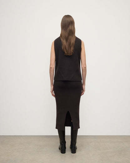 Model wears Johnstons of Elgin AW25 Women's Knitwear Molasses Sleeveless Brown Cashmere Tank Top Bank KBI01037SB7290