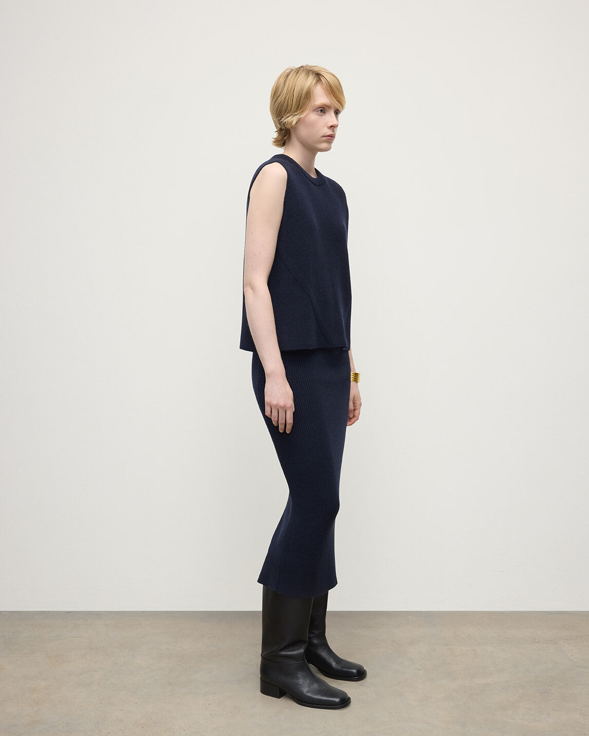 Model wearing Johnstons of Elgin AW25 Women's Knitwear Dark Navy Sleeveless Navy Cashmere Tank Top Side KBI01037SD7666