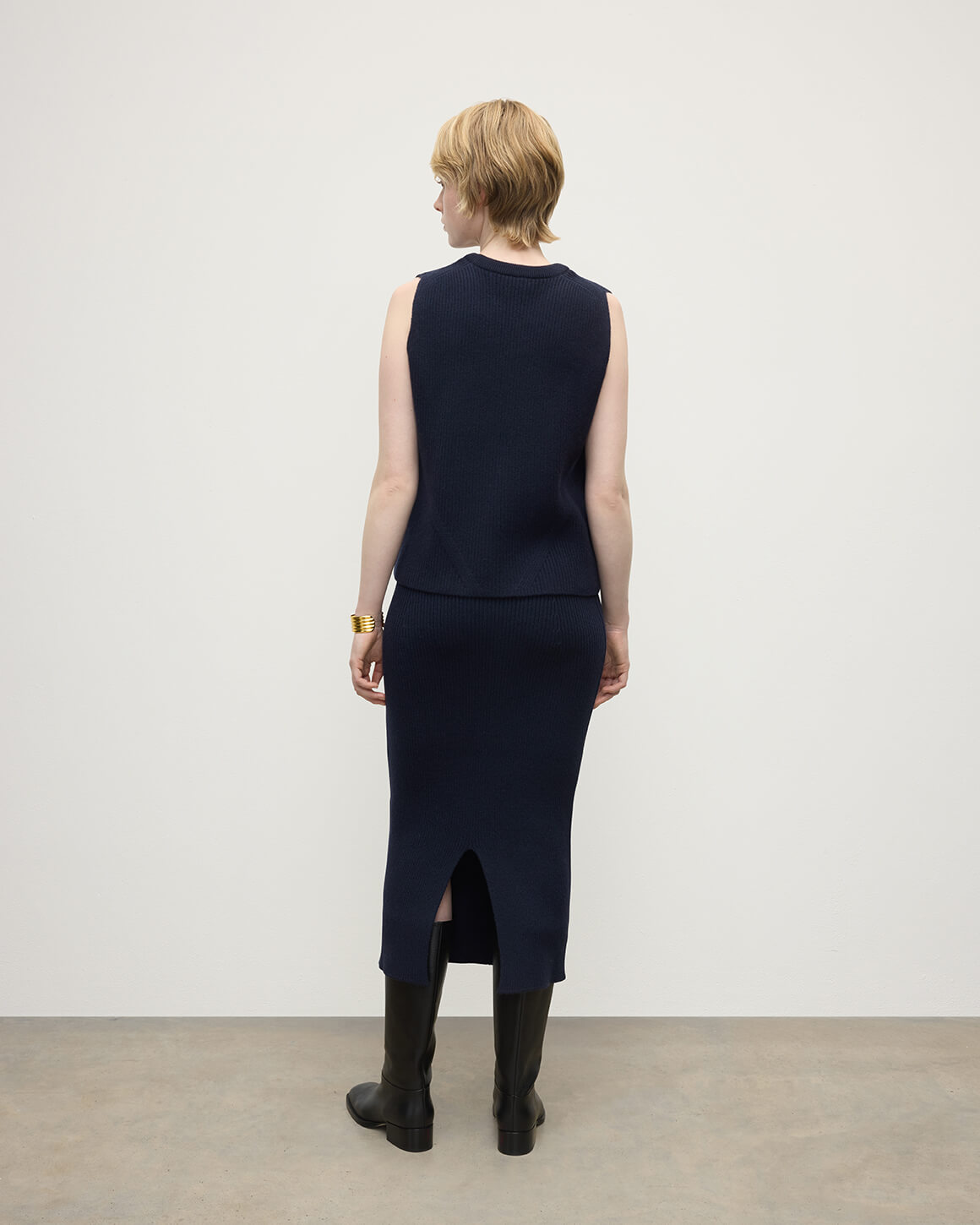 Model wearing Johnstons of Elgin AW25 Women's Knitwear Dark Navy Sleeveless Navy Cashmere Tank Top back  KBI01037SD7666