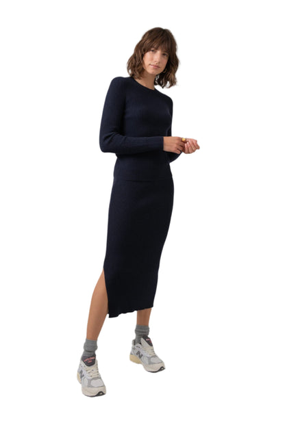 Johnstons of Elgin Ribbed Tube Cashmere Skirt in Dark Navy worn with matching Slim Fit Cashmere Sweater on a grey background KBP00923SD7286