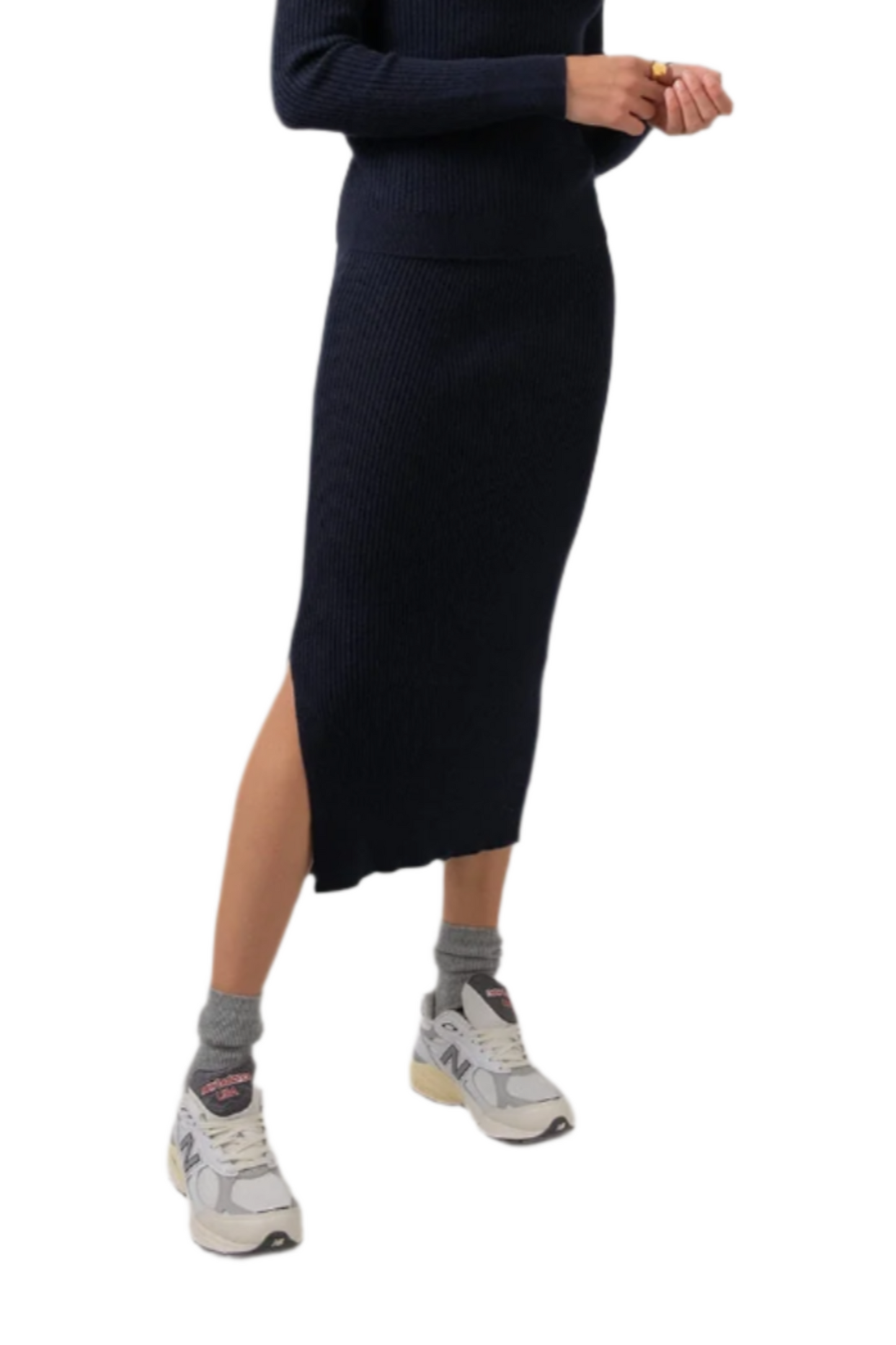 Johnstons of Elgin Ribbed Tube Cashmere Skirt in Dark Navy worn with matching Slim Fit Cashmere Sweater on a grey background KBP00923SD7286